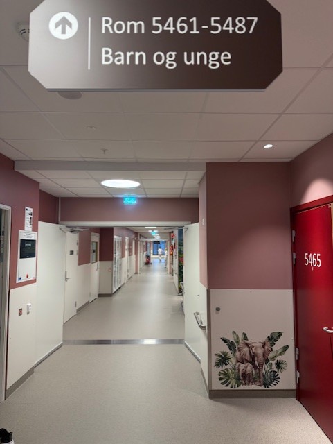 A hallway with red doors